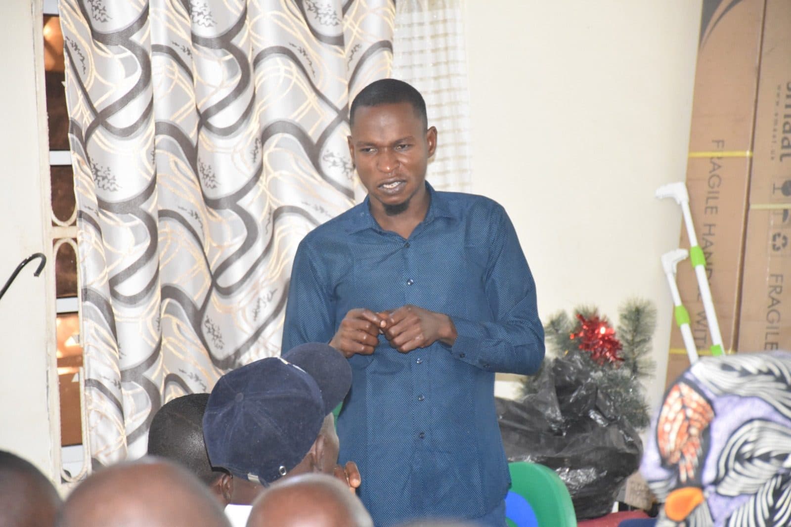 A URII team member addressing a community gathering